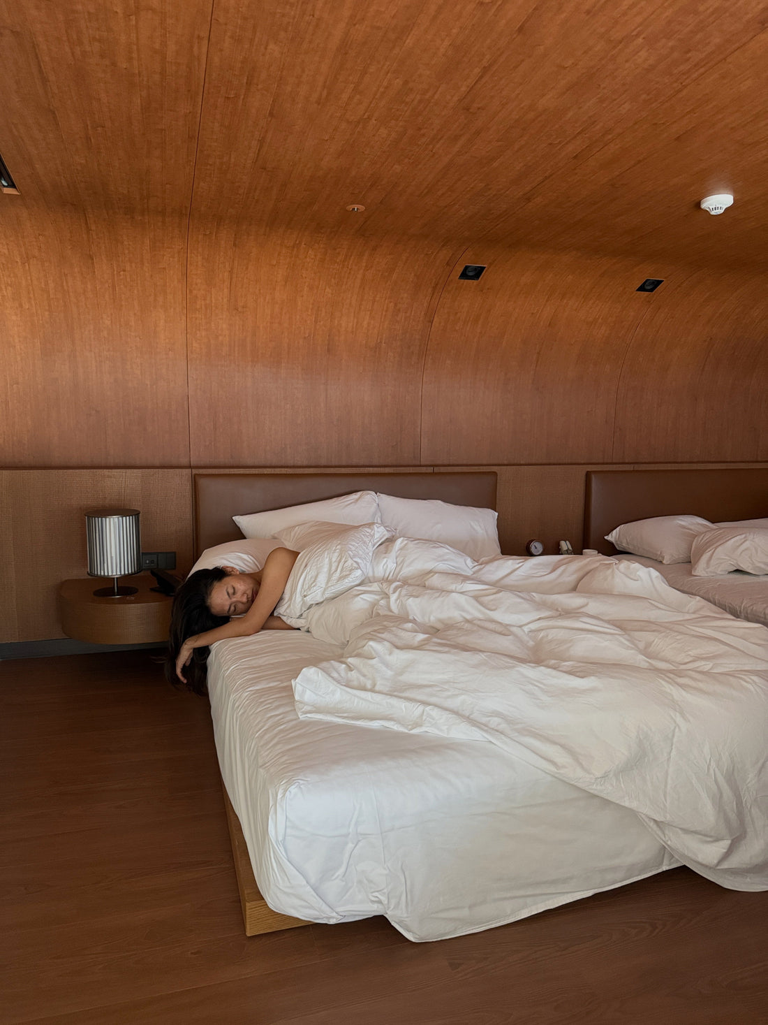 woman laying in bed sleeping, calm