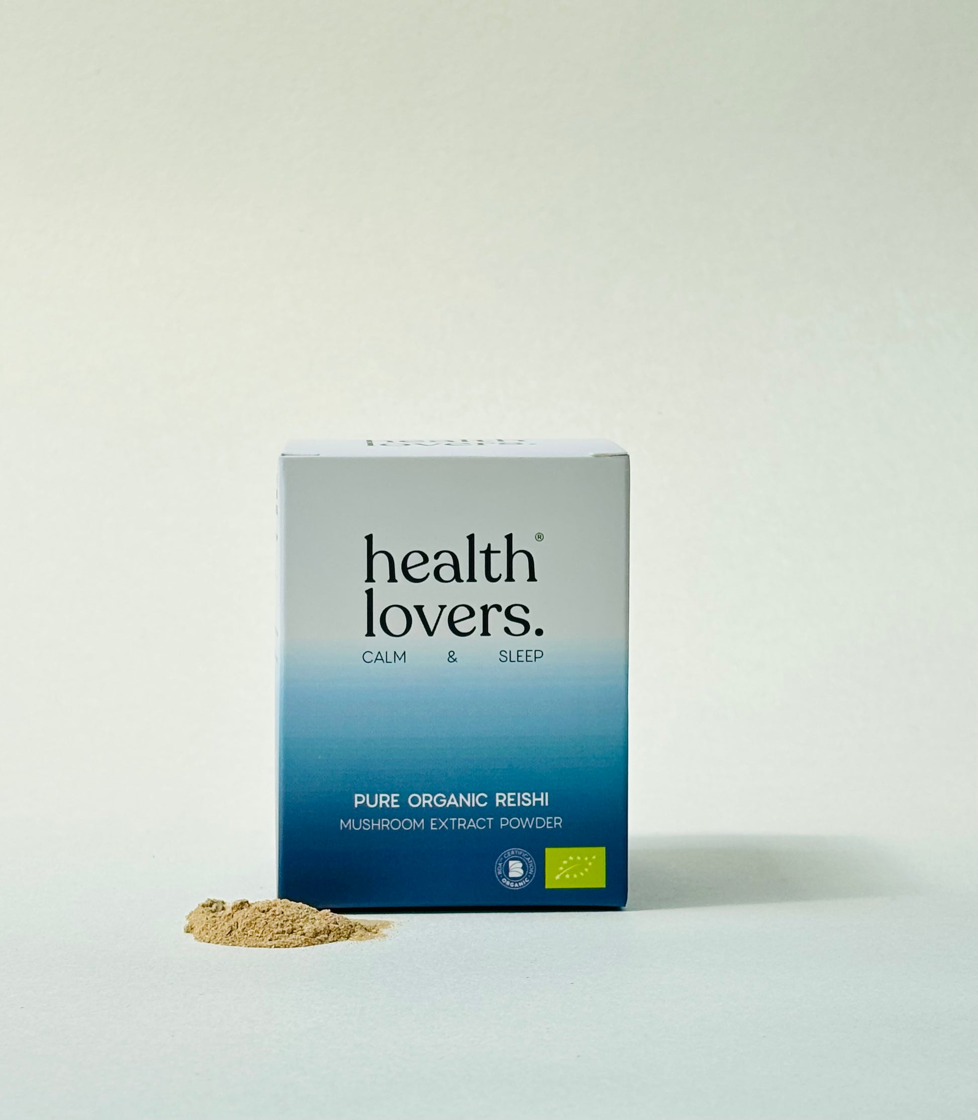 Box of 'health lovers' pure organic reishi mushroom extract powder on a white background