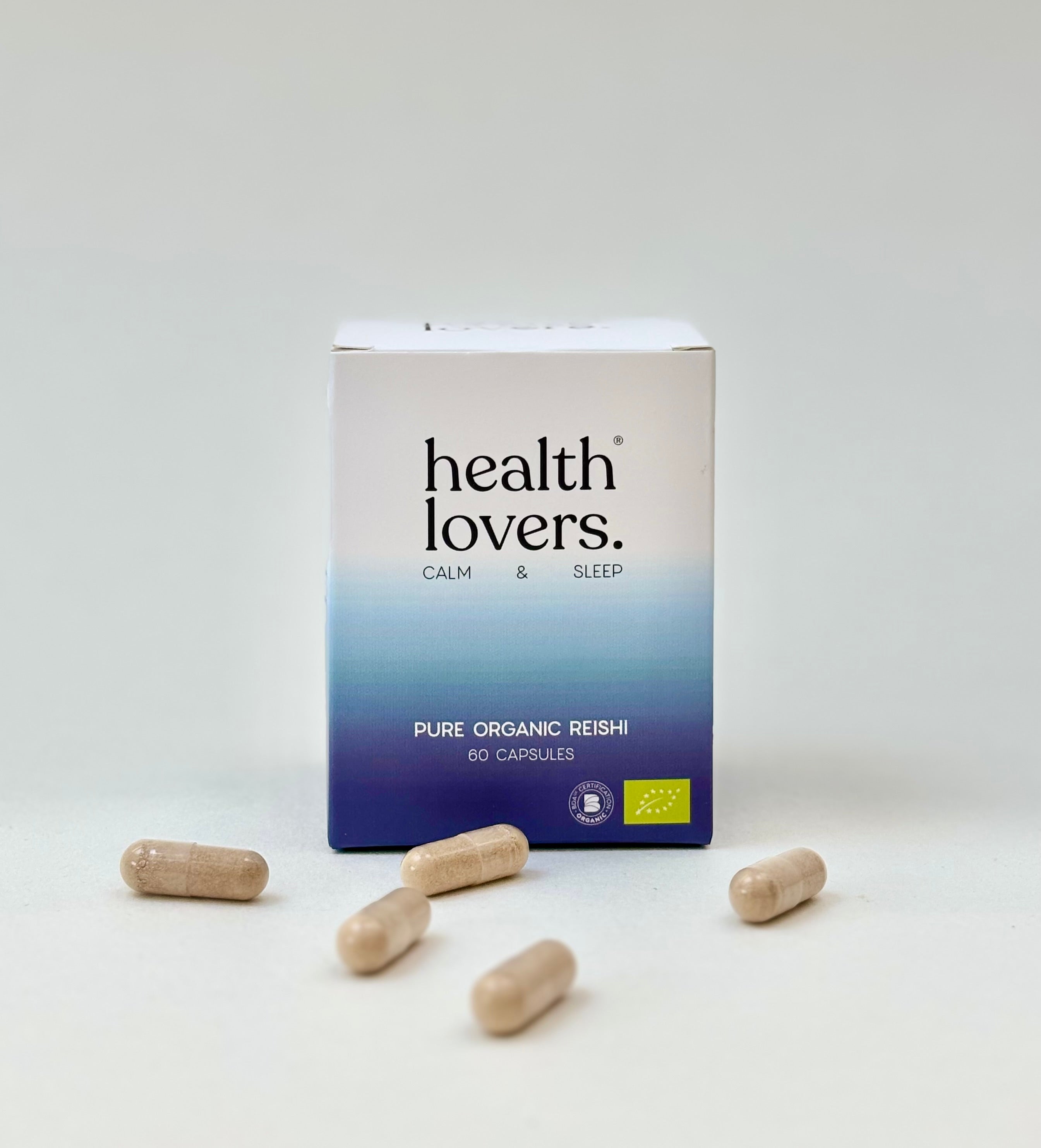 Box of 'health lovers.' Pure Organic Reishi capsules on a white background