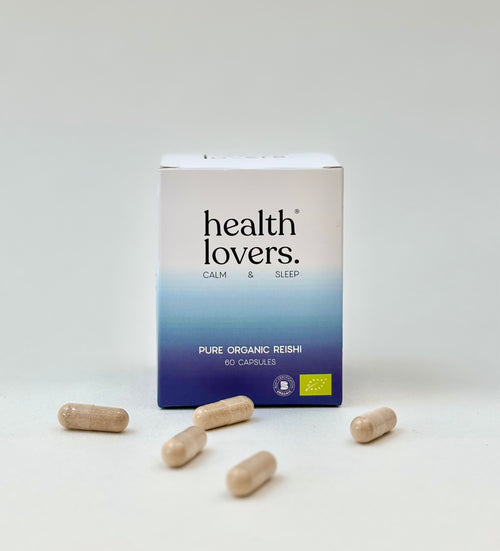 Box of 'health lovers.' Pure Organic Reishi capsules on a white background